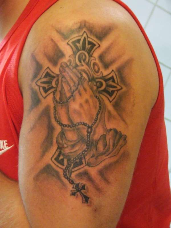 cross and hands tattoo