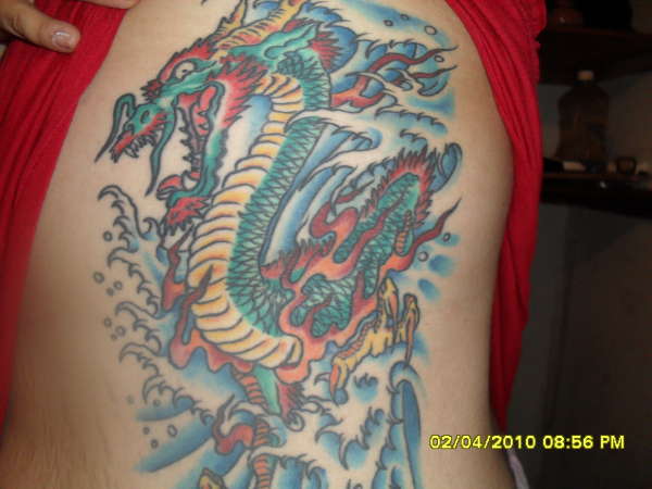 dragon in waves tattoo