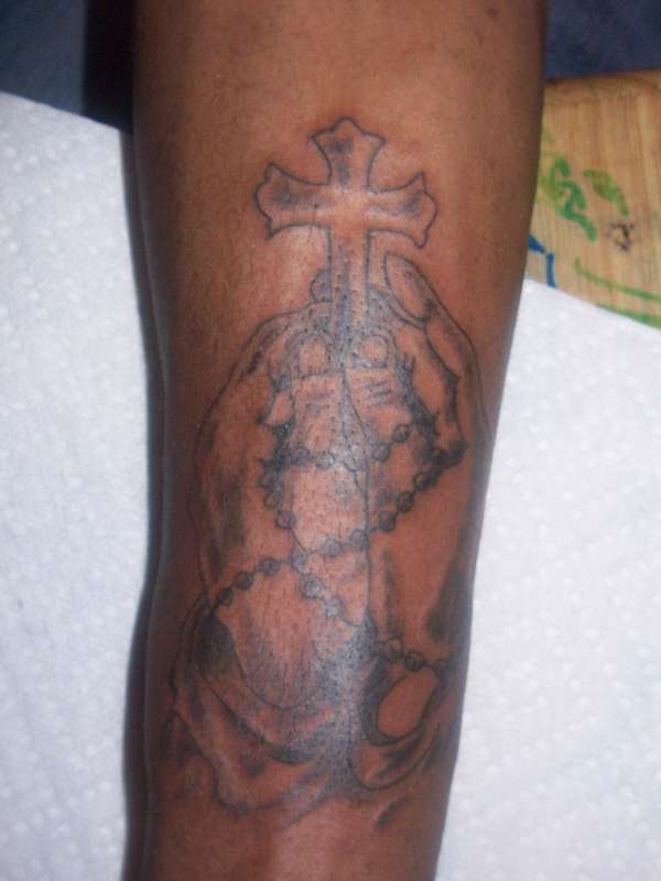 praying hands cross tattoo