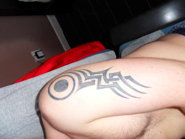 tribal comet tattoo