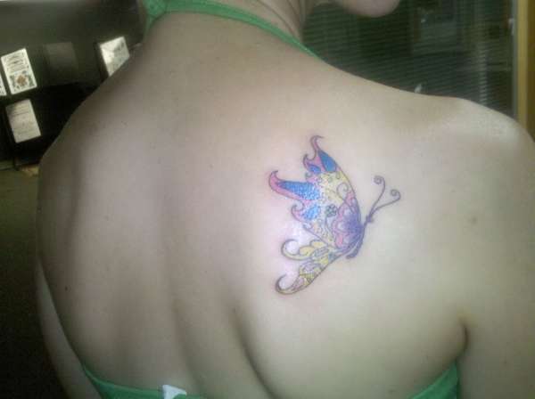 Detailed butterfly on right shoulder blade tattoo