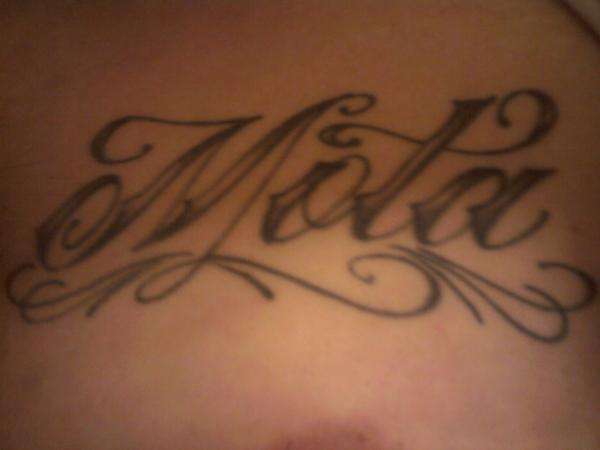 My last name on my chest (1st tat) tattoo
