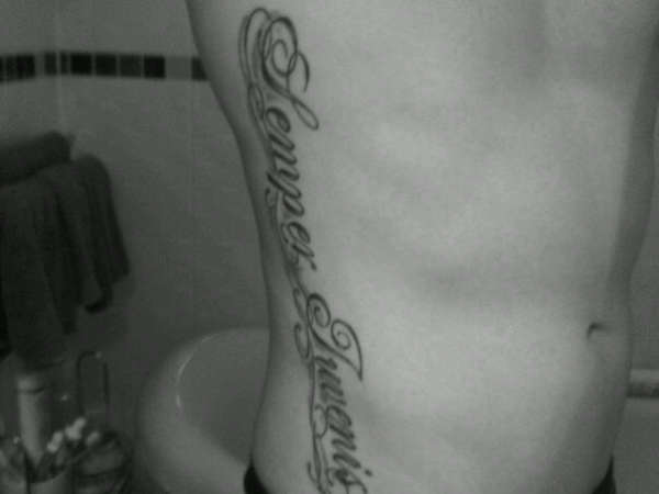 Semper Iuvenis on ribs tattoo