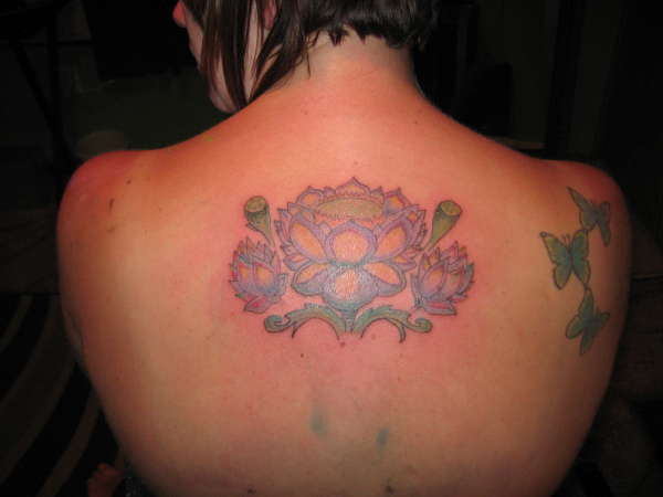 Sitting one of Lotus Flower tattoo