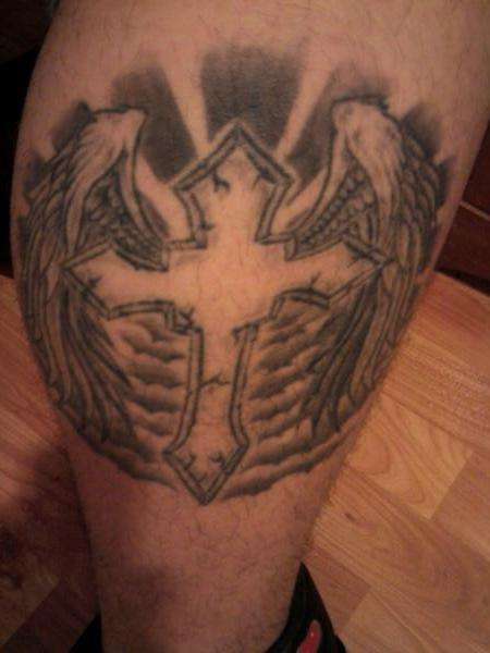 Winged cross on my right leg tattoo