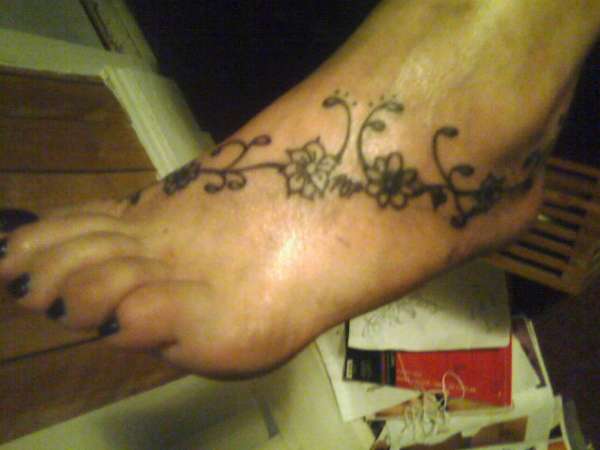 caries foot tattoo
