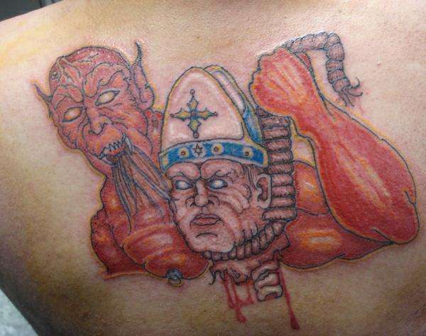 devil holding the popes head cut off tattoo