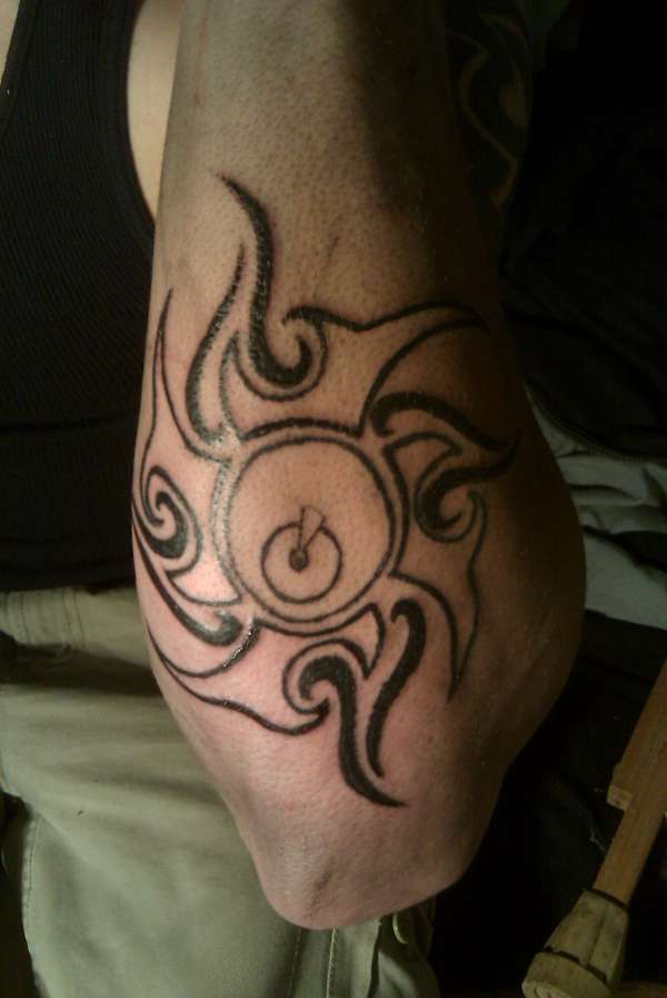 tribal sun tattoo
