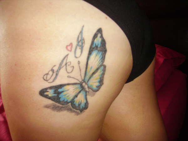 Butterfly on left bum cheek tattoo