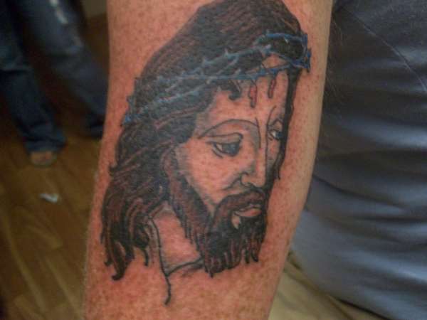 Jesus on the back of an arm... tattoo