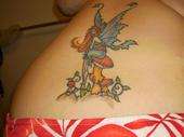 Lower Back Fairy and Mushroom tattoo
