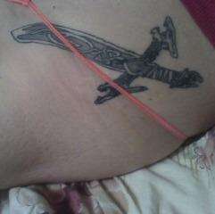 Protection rune on a rune master's sword tattoo