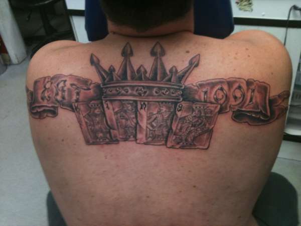 first tat. last name (king) on the cards tattoo