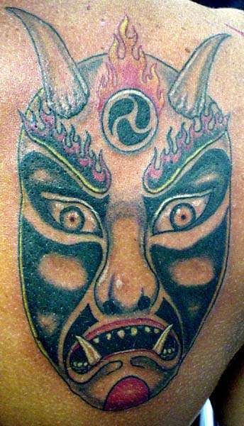 demon mask tattoo