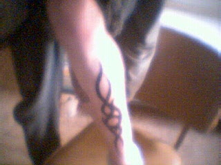 Tribal leg tattoo