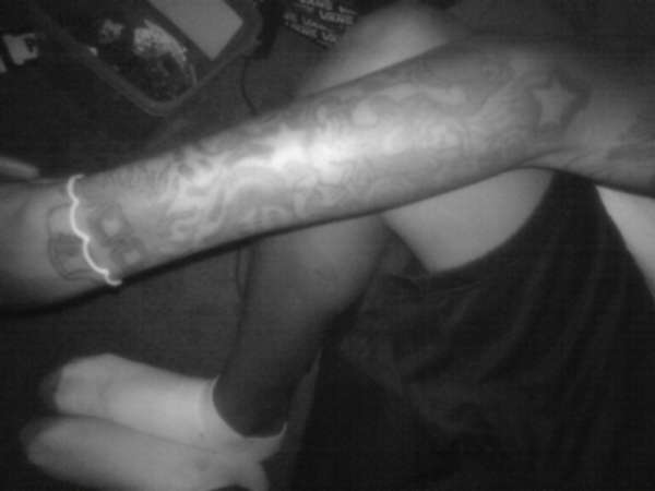right arm sleev(happy) tattoo