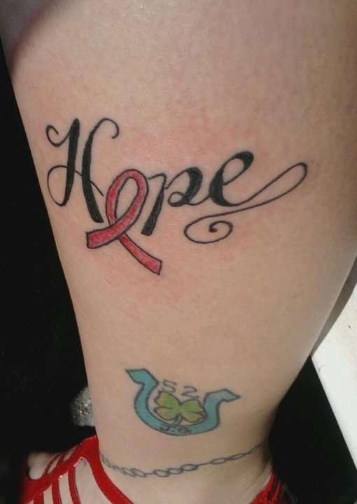 Breast Cancer Piece tattoo