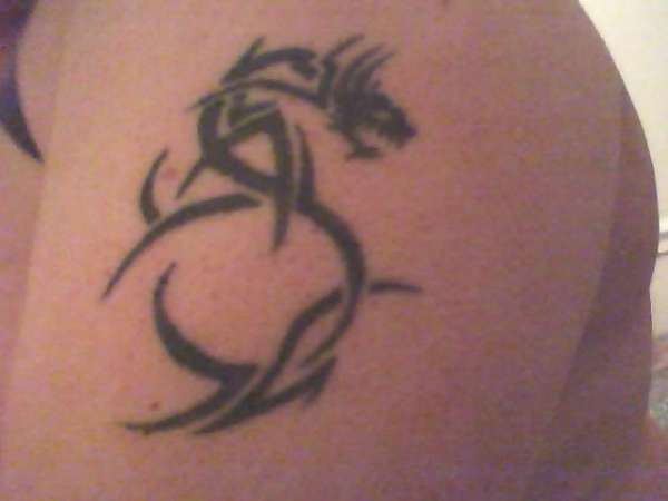 Left arm dragon tattoo