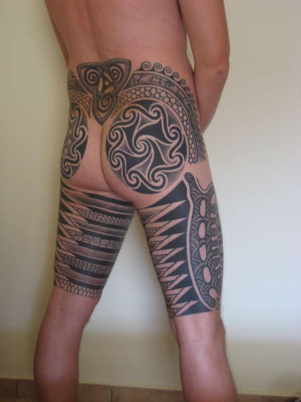 Tribal legs tattoo