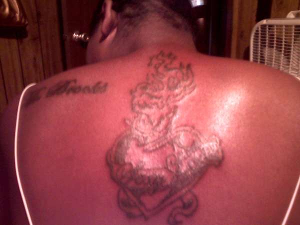 a heart with fire tattoo