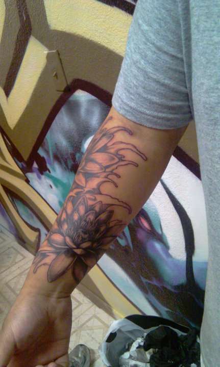 lotus/wave half sleeve in prog tattoo