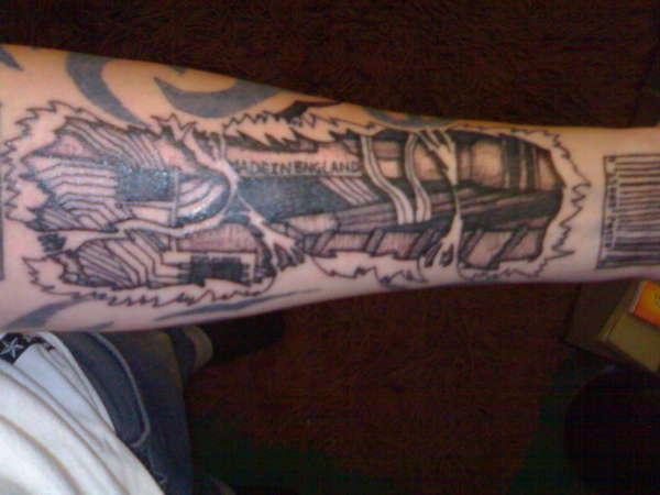 biomech forearm tattoo
