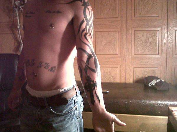 freehand tribal sleeve tattoo