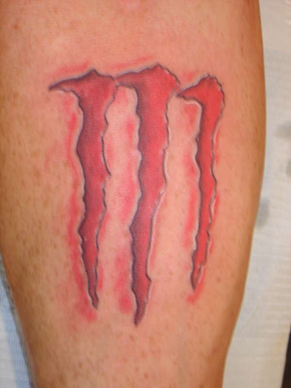 monster logo tattoo
