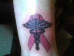 nursing symbol with breast cancer ribbon tattoo