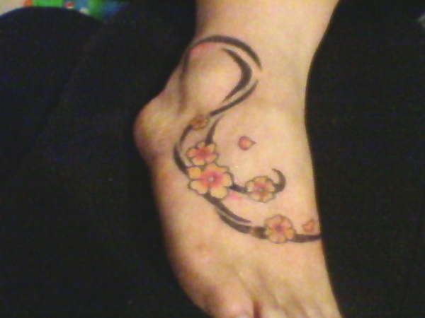Flower s on my foot tattoo