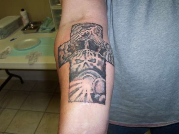 One of a kind cross tattoo