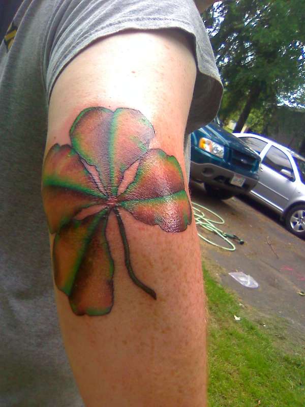 Wilted four leaf clover. tattoo
