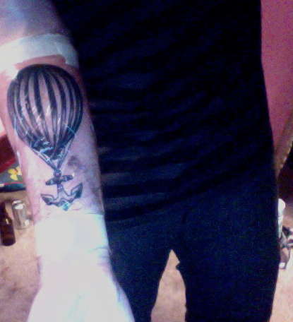 a weight being lifted tattoo