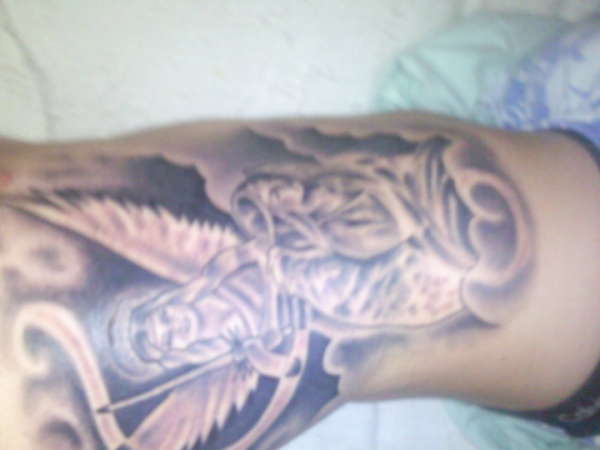 guardian angels on ribs tattoo