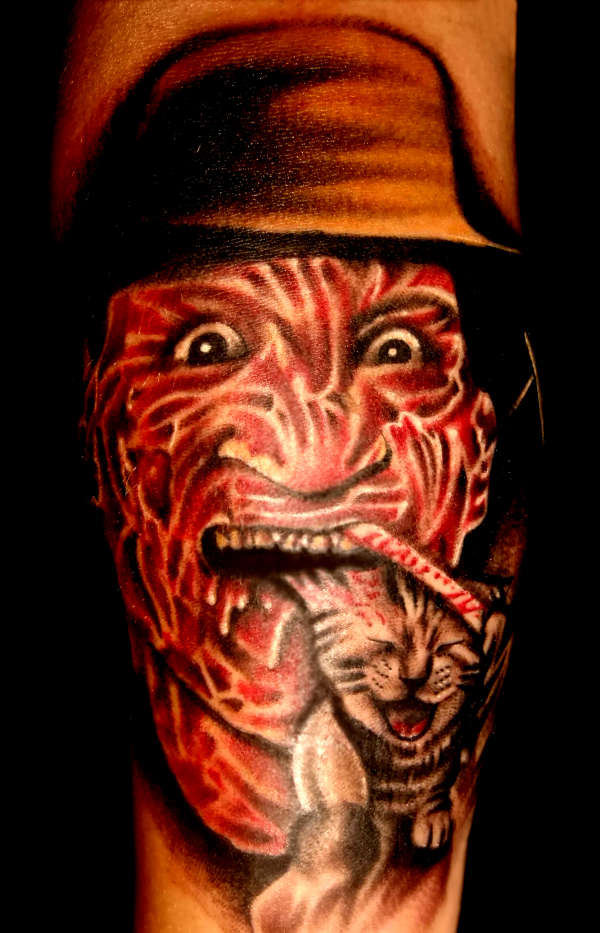 Freddy has Kitty Dinner tattoo