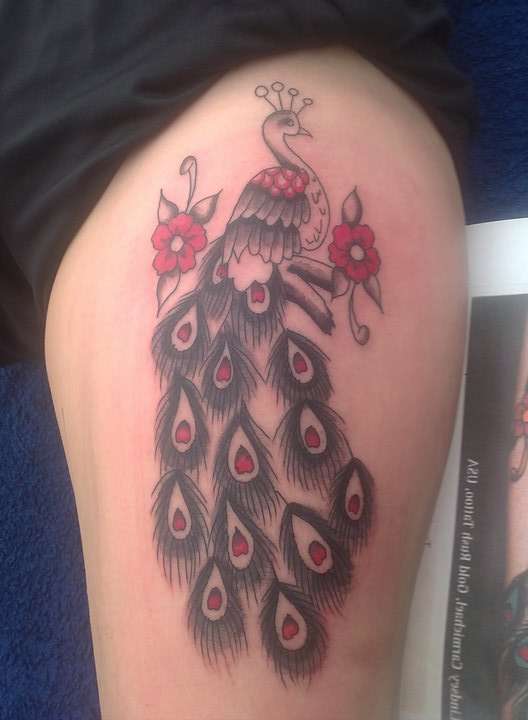 Peacock upper left leg half done tattoo