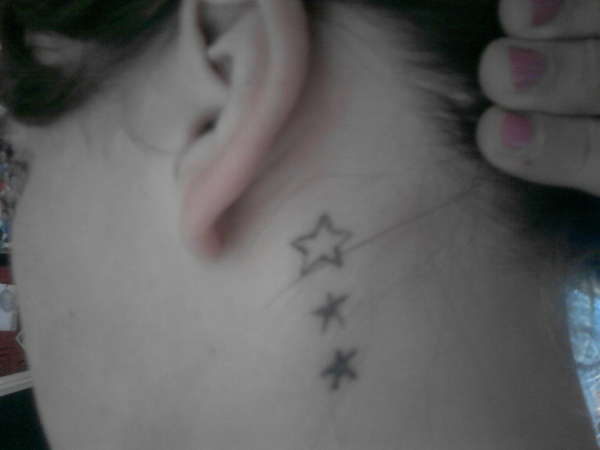 Stars on neck tattoo
