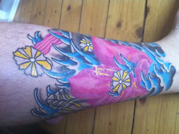 ibiza flower leg tattoo