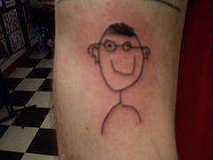 Stick kid tattoo