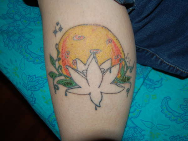 lotus blossom in front of moon tattoo