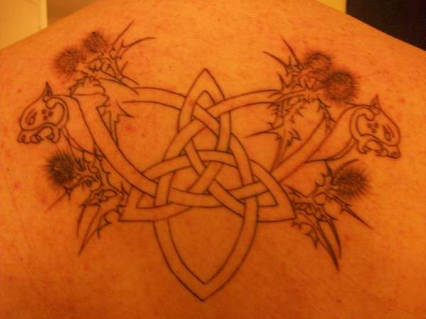 celtic trinity knot with thistles and war dogs tattoo
