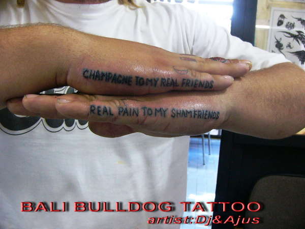 reading on hands tattoo