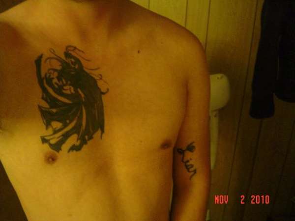 Dragon with cape tattoo