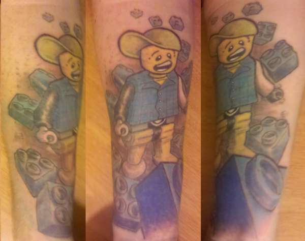 Forearm Lego man tattoo