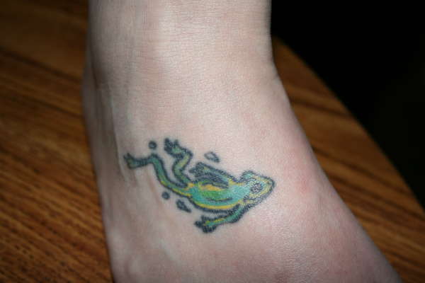 Frog on foot tattoo