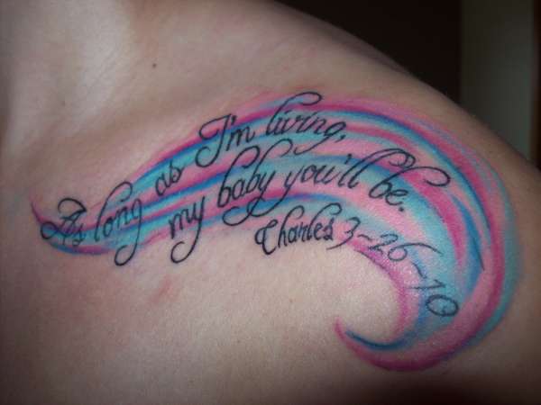 Shoulder lettering tattoo