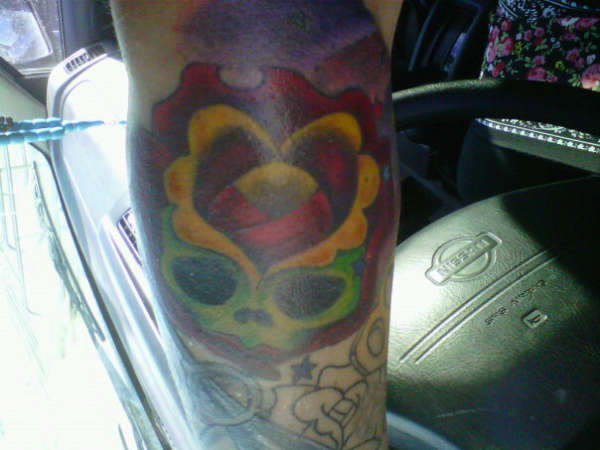 Skull rose tattoo