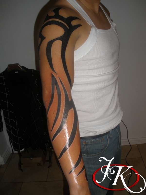 TRADITIONAL TRIBAL SLEEVE TATTOO SIDE VIEW BY JUSTIN KONTRA tattoo