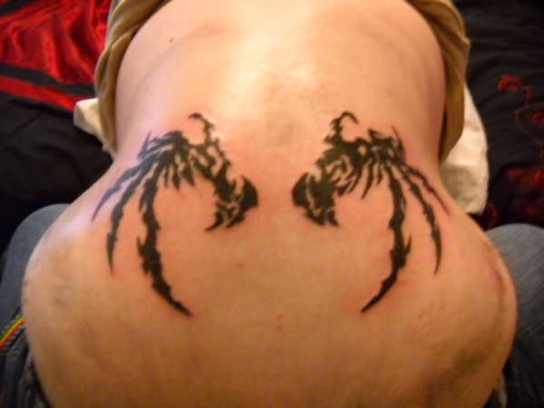 Tribal wings tattoo