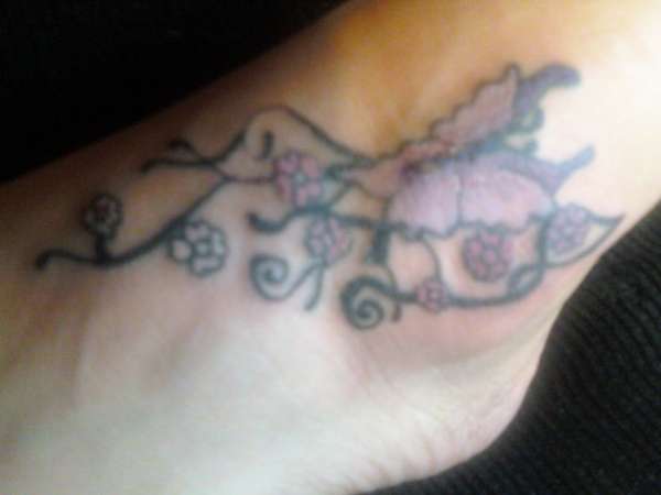 butterfly on foot tattoo